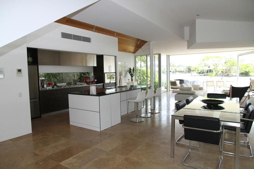 Spacious modern open-plan kitchen and living room with large windows.